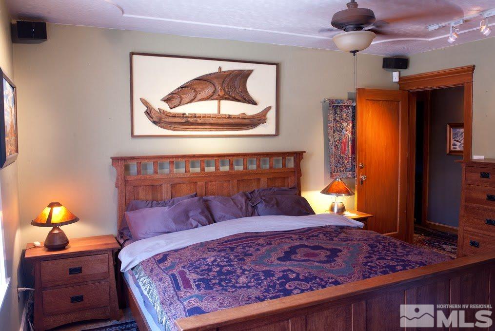 19 Winter Street Reno, NV 89503 - Photo 23 of 40 a bedroom with a bed and wooden floor