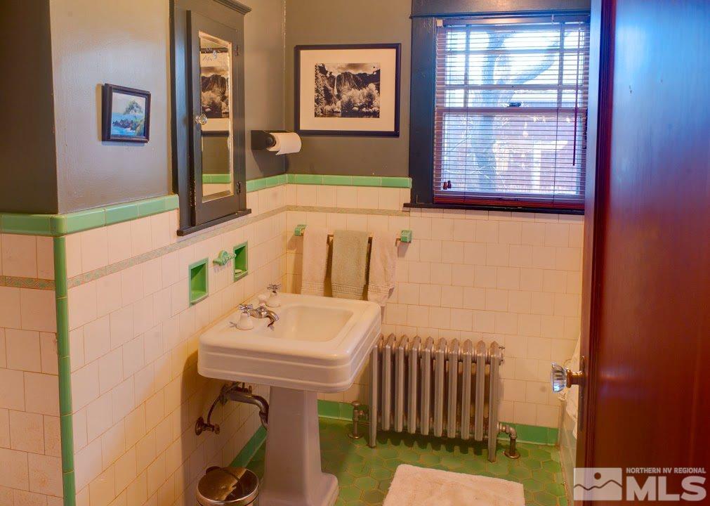 19 Winter Street Reno, NV 89503 - Photo 25 of 40 a bathroom with a sink and a mirror