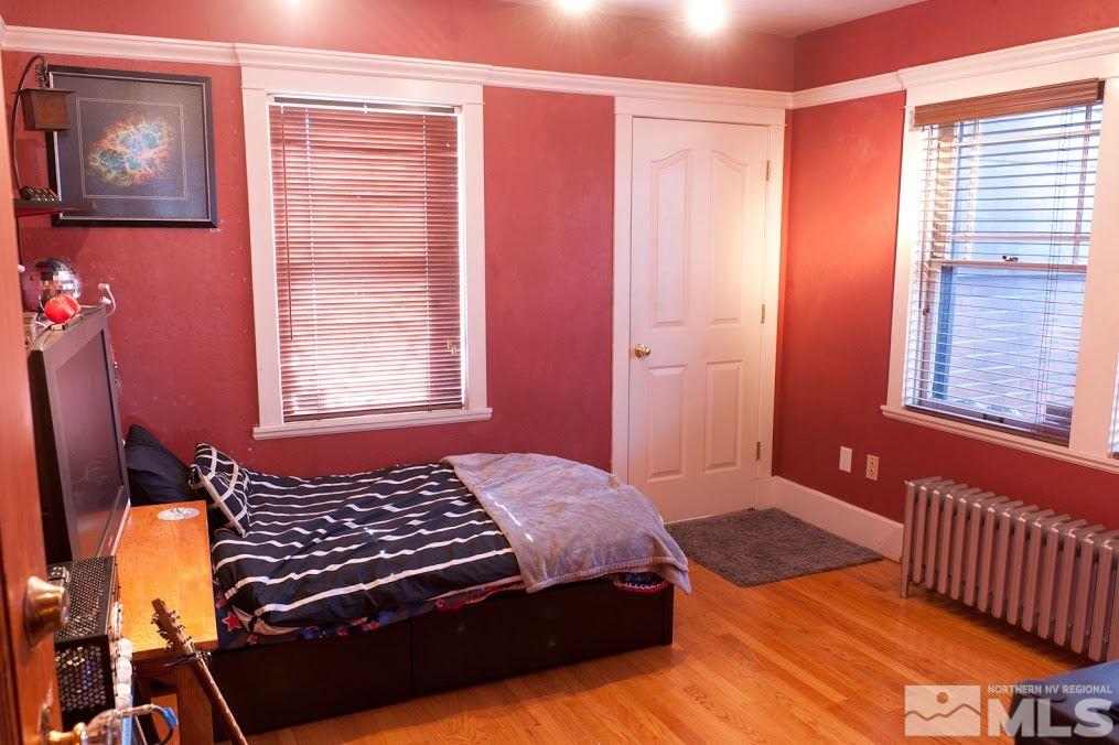 19 Winter Street Reno, NV 89503 - Photo 26 of 40 a bedroom with a bed and wooden floor