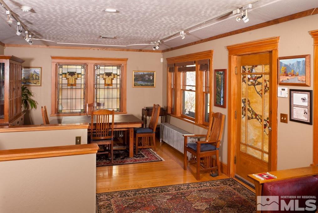 19 Winter Street Reno, NV 89503 - Photo 4 of 40 a living room with furniture a large window and a dining table