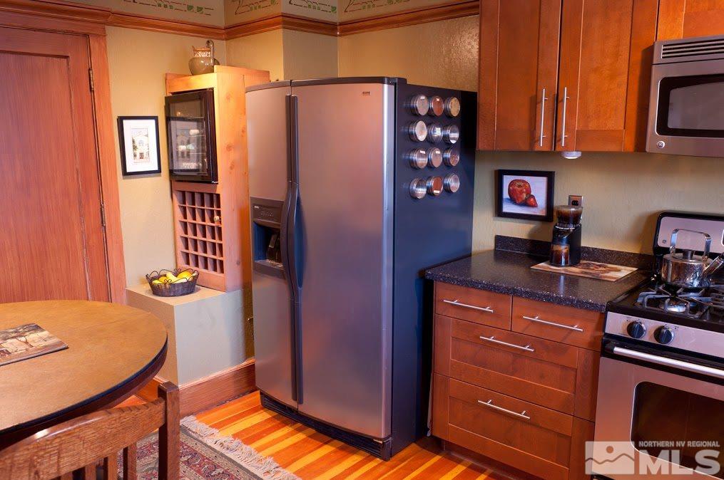 19 Winter Street Reno, NV 89503 - Photo 6 of 40 a kitchen with stainless steel appliances granite countertop a refrigerator and a stove top oven