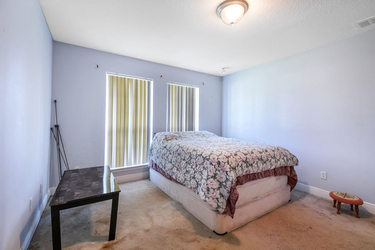 46 Riddle Drive Palm Coast, FL 32164 - Photo 11 of 20 a spacious bedroom with a bed and window
