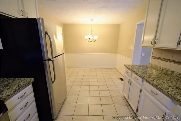 a kitchen with a stove and a microwave