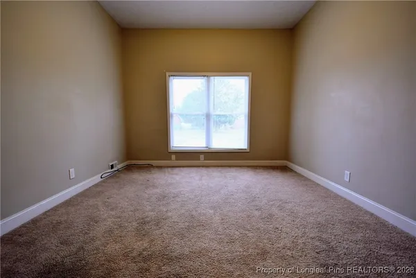 a view of an empty room with a door
