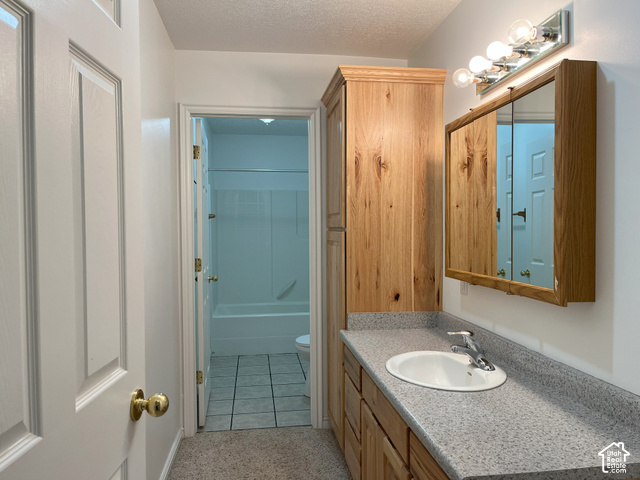 750 South Big Road Soda Springs, ID 83276 - Photo 28 of 40 Vanity with a solid surface countertop, an undermount sink, and wood-finish cabinetry