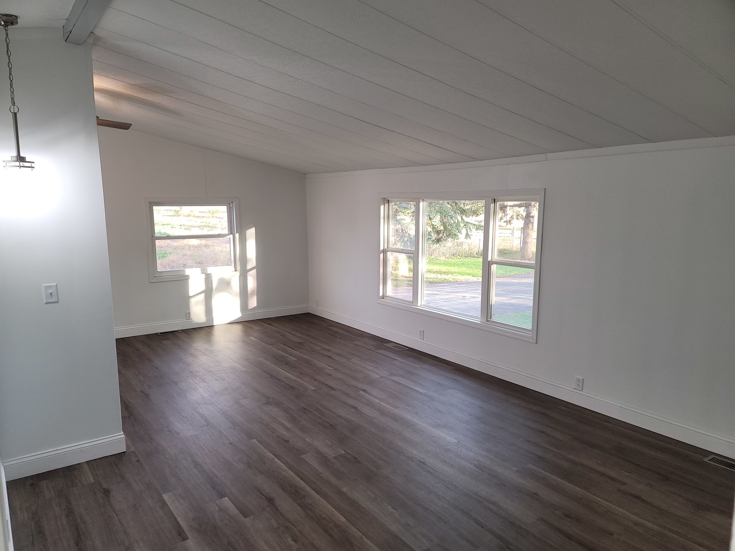 25544 Gaulrapp Road Rock Falls, IL 61071 - Photo 3 of 18 a view of an empty room with wooden floor and a window