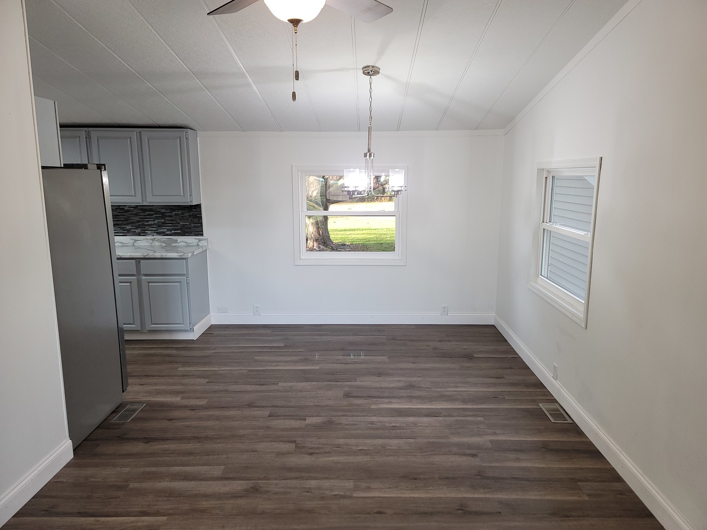 25544 Gaulrapp Road Rock Falls, IL 61071 - Photo 4 of 18 a view of an empty room with a window and wooden floor