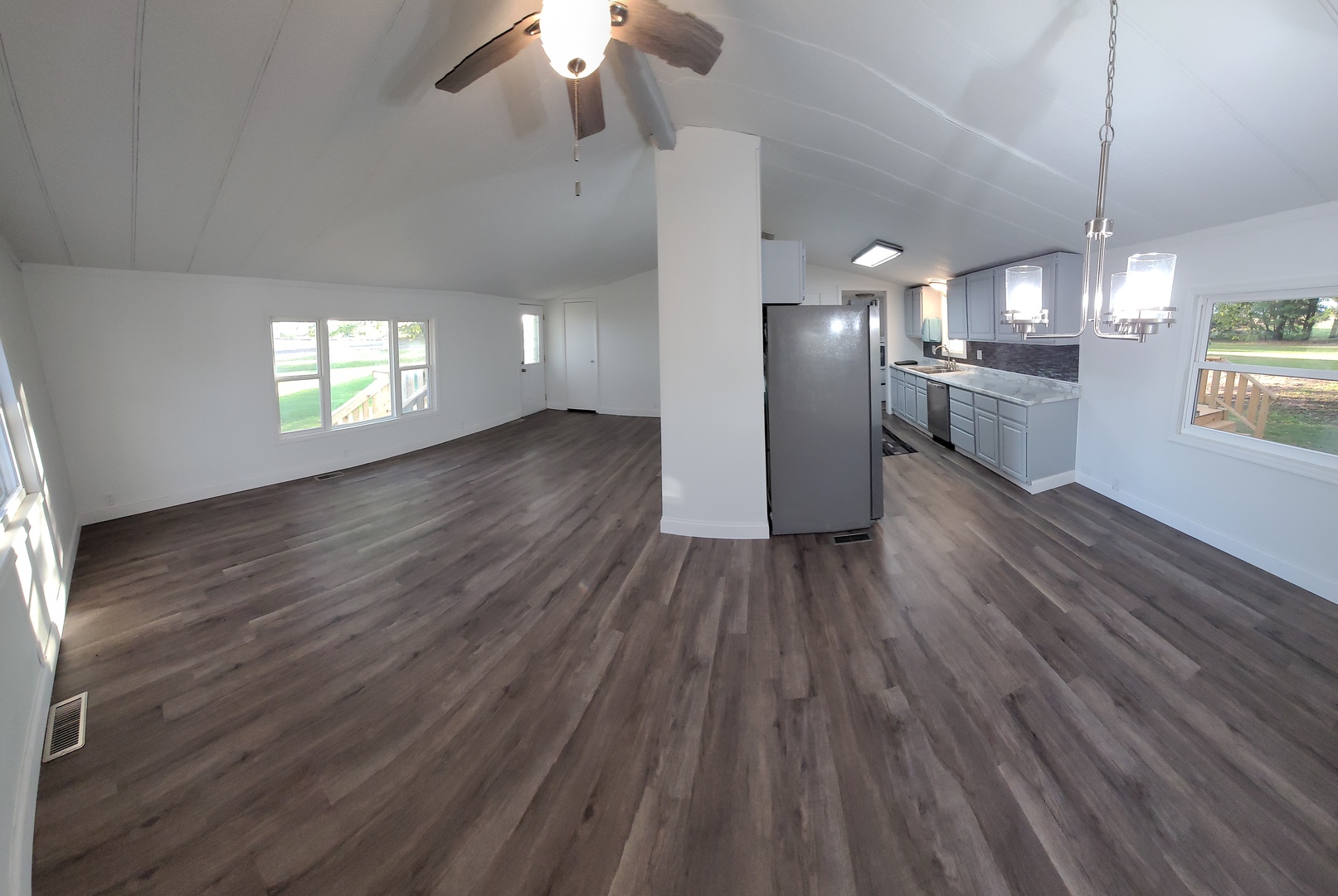 25544 Gaulrapp Road Rock Falls, IL 61071 - Photo 6 of 18 a view of an empty room with a window and wooden floor