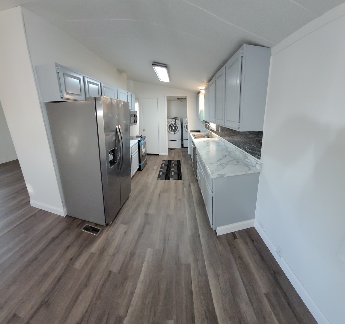 25544 Gaulrapp Road Rock Falls, IL 61071 - Photo 7 of 18 a view of a refrigerator in kitchen and wooden floor