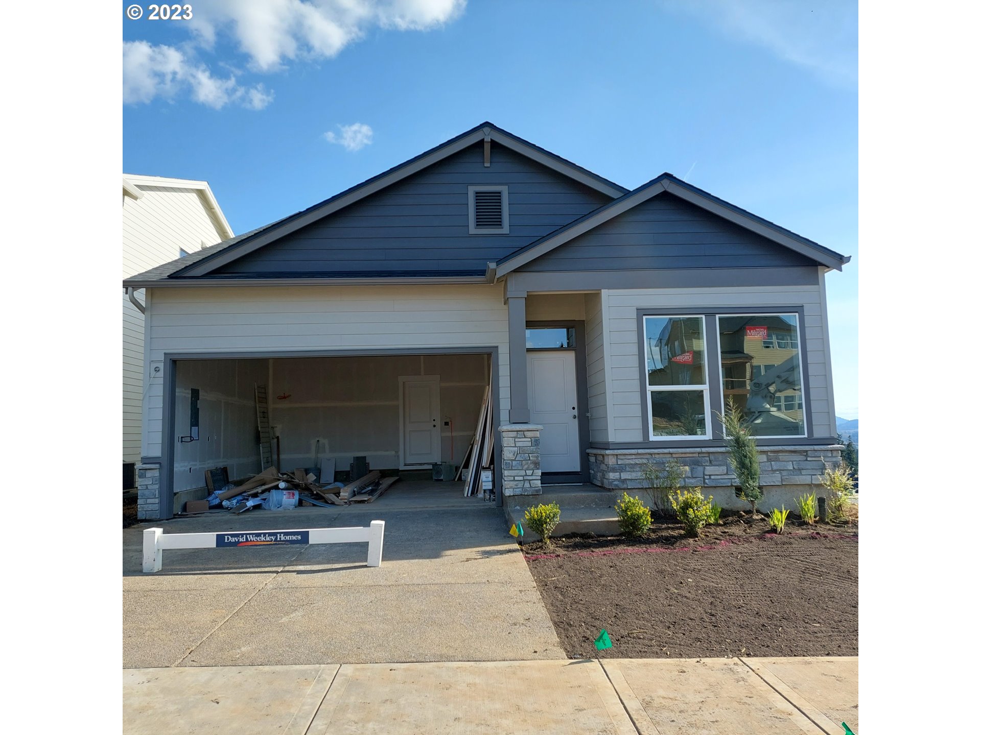 a front view of a house with yard