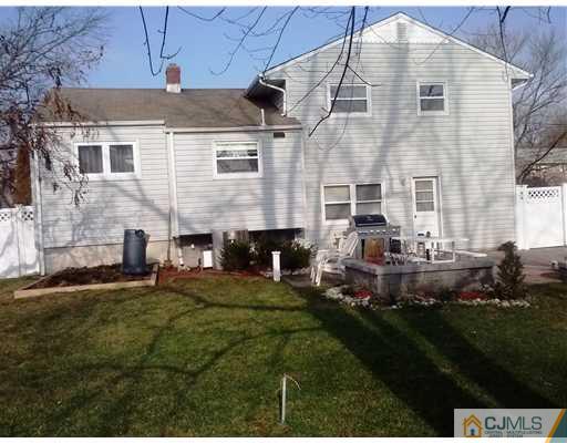 14 Barlow Road Edison, NJ 08817 - Photo 2 of 16 a front view of a house with a garden and yard