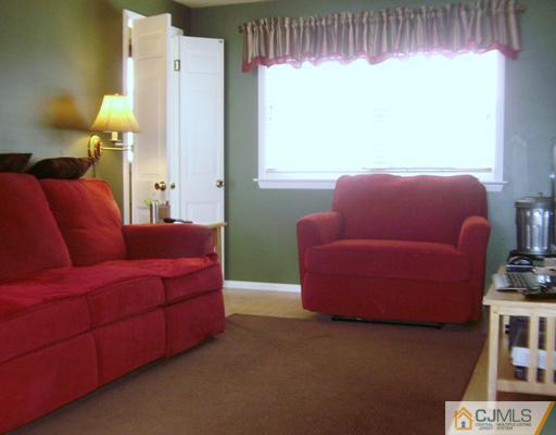 14 Barlow Road Edison, NJ 08817 - Photo 12 of 16 a living room with furniture and a window