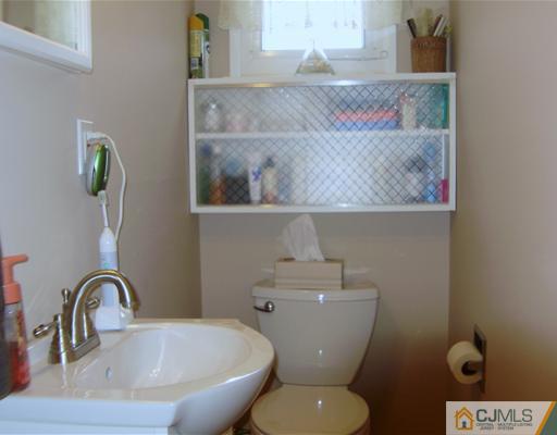 14 Barlow Road Edison, NJ 08817 - Photo 16 of 16 a bathroom with a toilet and sink