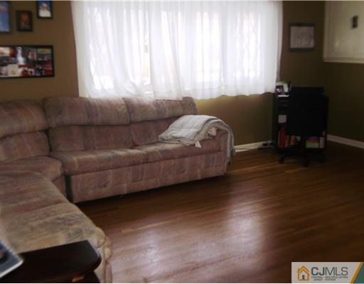 14 Barlow Road Edison, NJ 08817 - Photo 7 of 16 a living room with furniture and a window