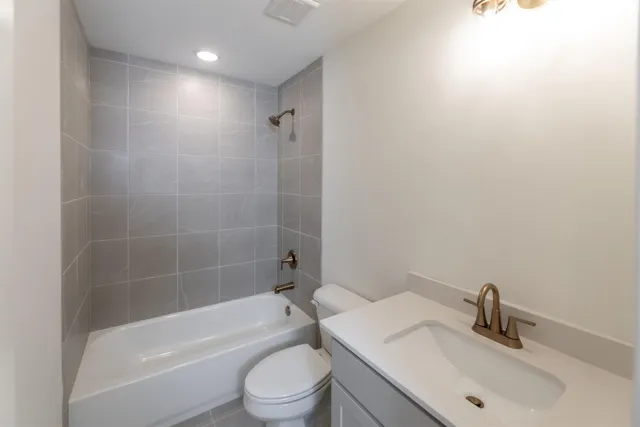 a bathroom with a sink toilet and bathtub
