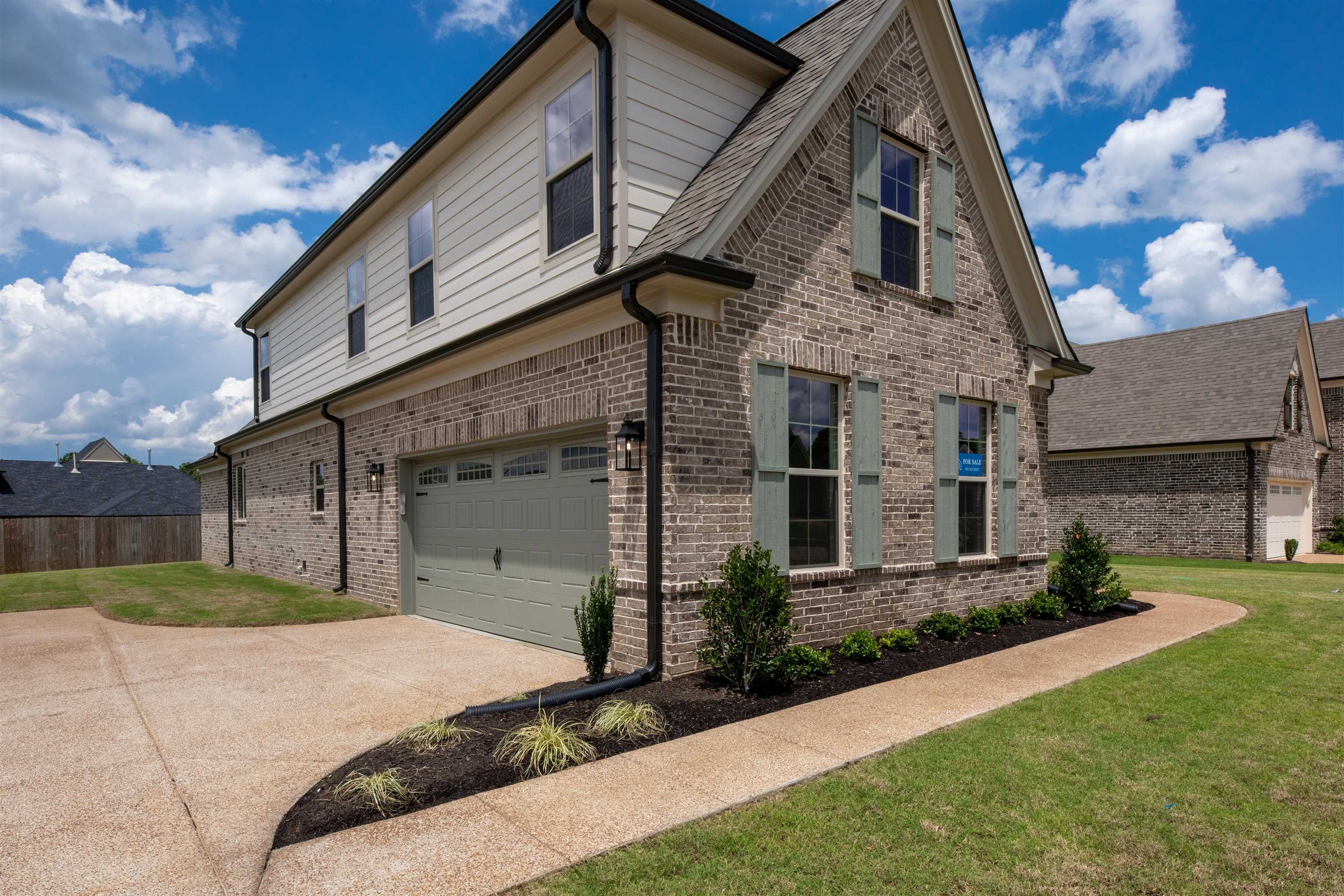 95 Misty Rdg Loop Oakland, TN 38060 - Photo 2 of 23 a front view of a house with a garden and plants