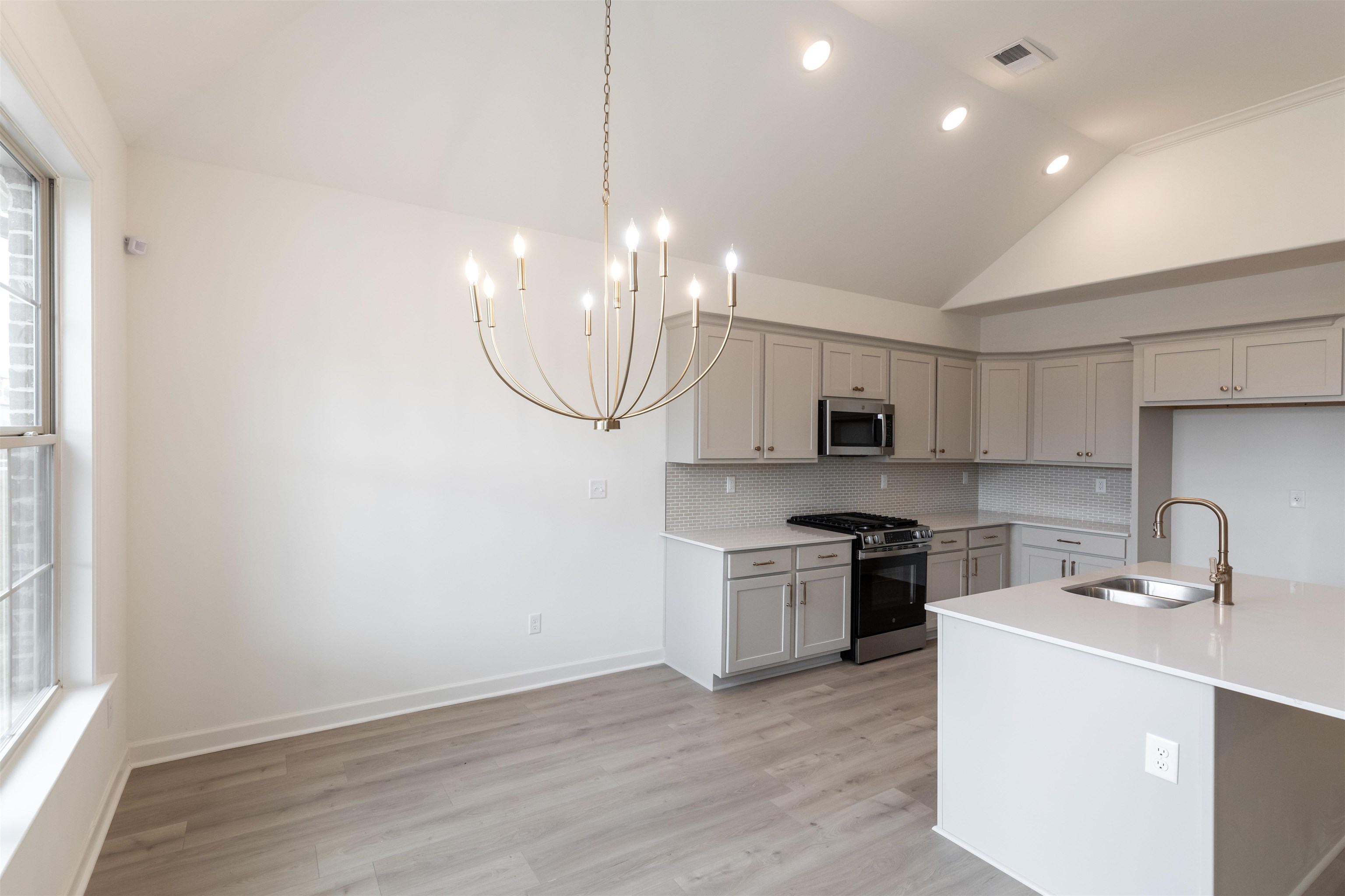 95 Misty Rdg Loop Oakland, TN 38060 - Photo 5 of 23 a kitchen with stove cabinets and wooden floor