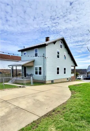 a house view with a outdoor space