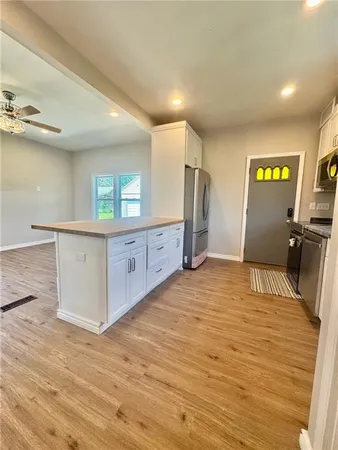 a view of a kitchen with a sink