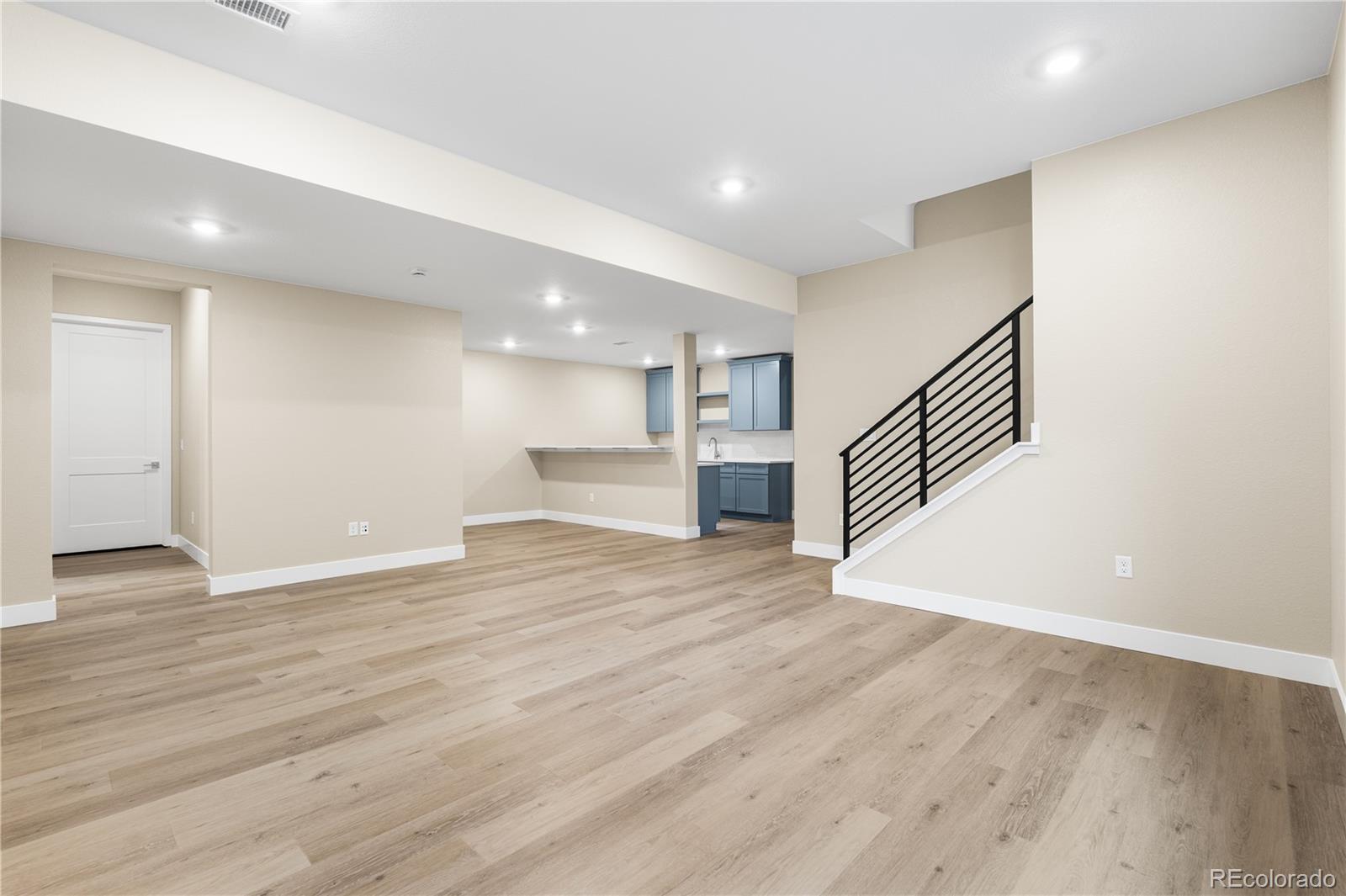 11118 Encantado Trail Lone Tree, CO 80134 - Photo 14 of 50 a view of empty room with wooden floor