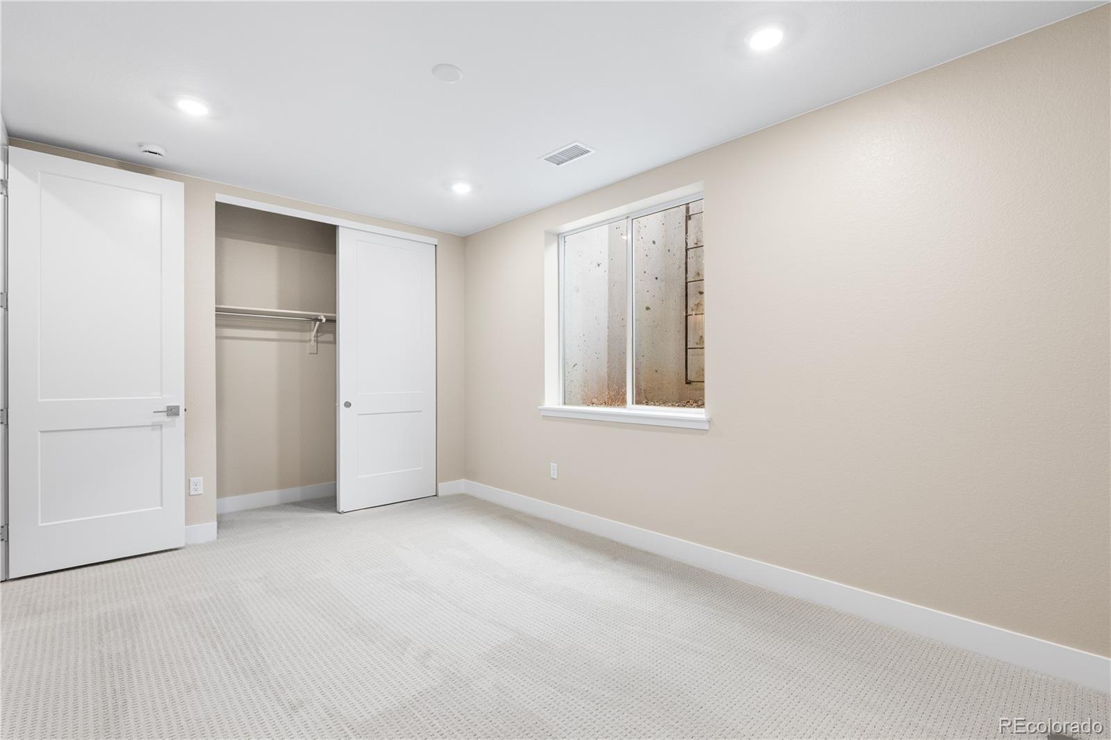 11118 Encantado Trail Lone Tree, CO 80134 - Photo 30 of 50 a view of an empty room with a window