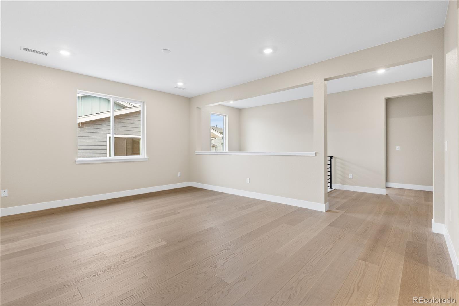 11118 Encantado Trail Lone Tree, CO 80134 - Photo 34 of 50 wooden floor in an empty room with a window