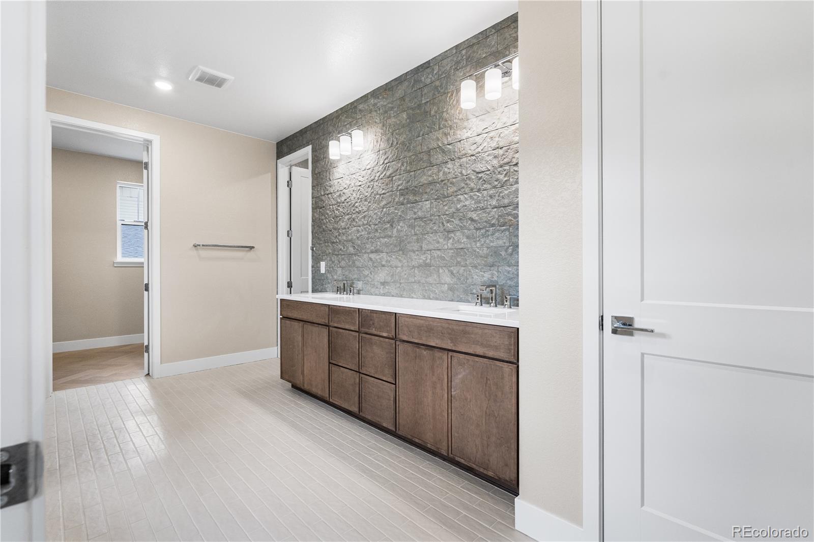 11118 Encantado Trail Lone Tree, CO 80134 - Photo 36 of 50 a view of an empty room with wooden floor and a window