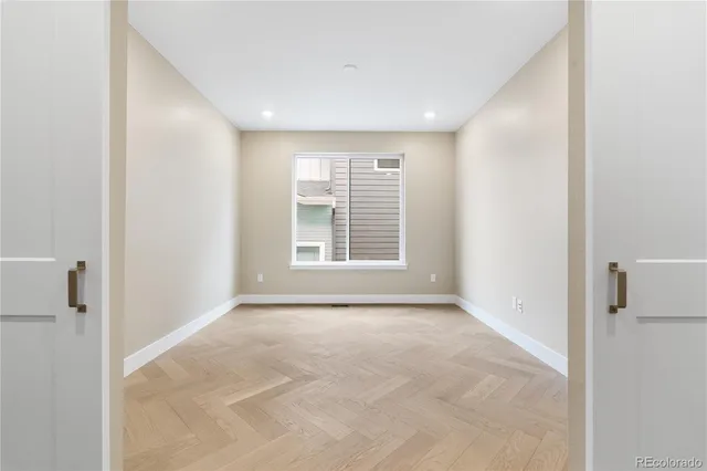 a view of an empty room with a window