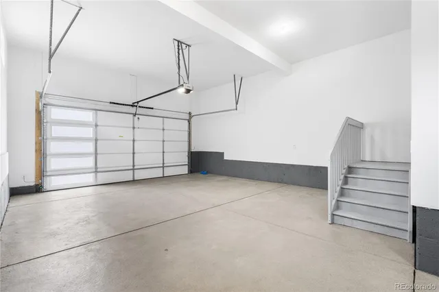 a view of a garage with stairs