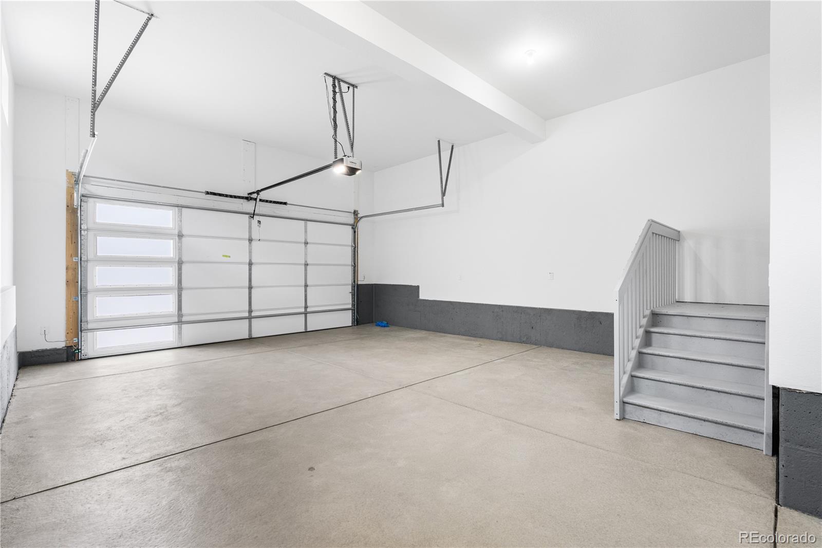 11118 Encantado Trail Lone Tree, CO 80134 - Photo 46 of 50 a view of a garage with stairs