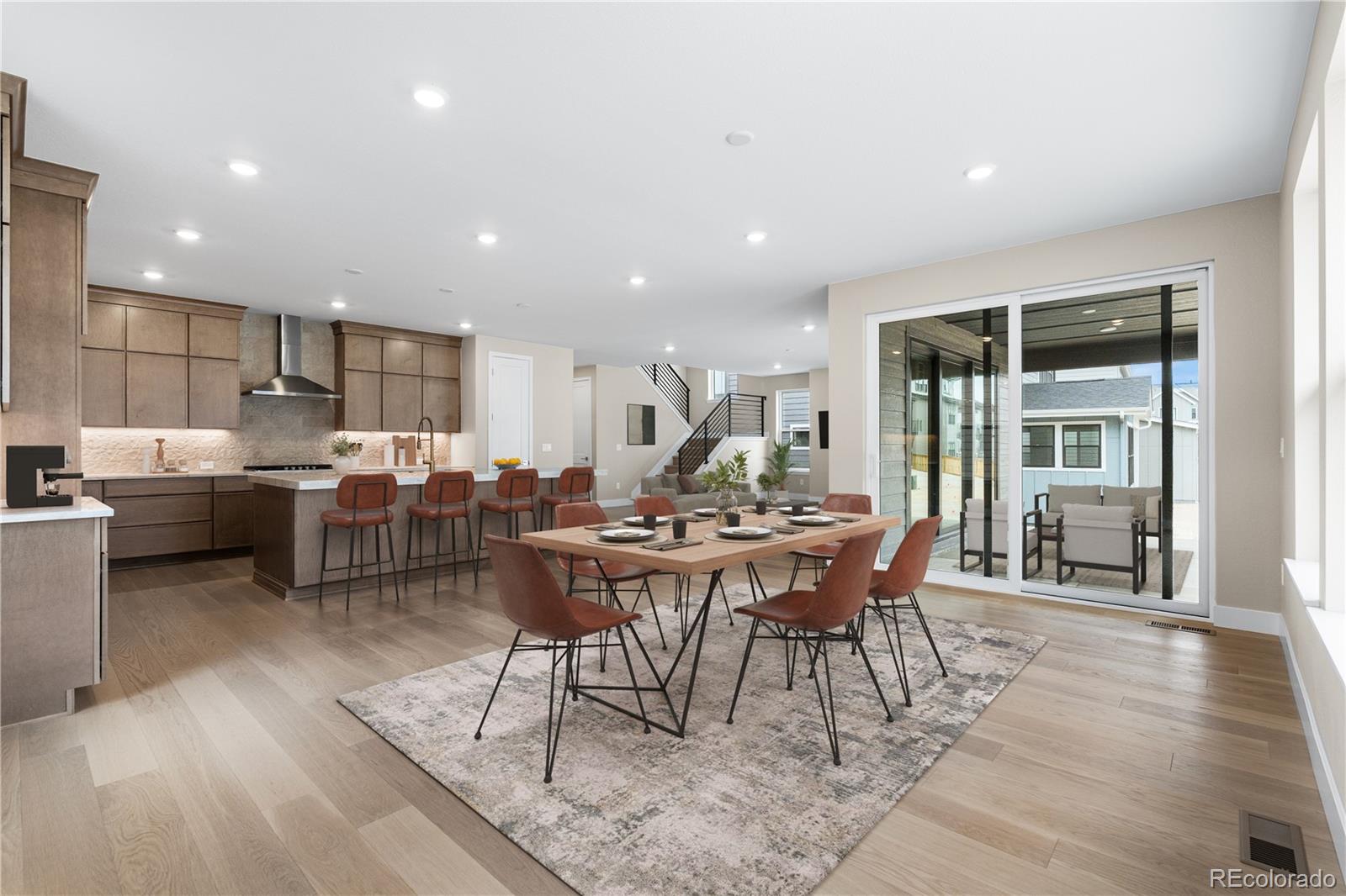 11118 Encantado Trail Lone Tree, CO 80134 - Photo 7 of 50 a view of a dining room with furniture