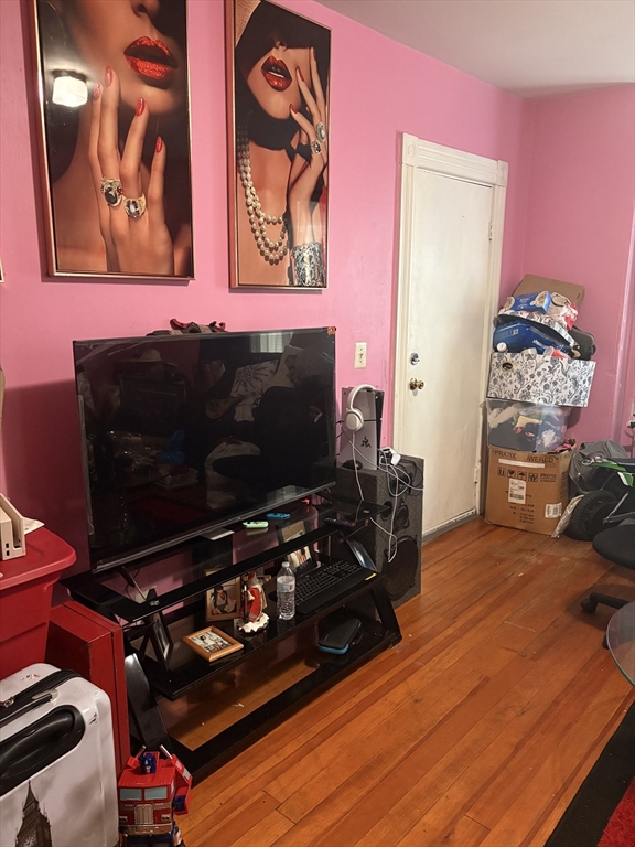 140 South Common Street Lynn, MA 01902 - Photo 2 of 10 a room with furniture and flat screen tv