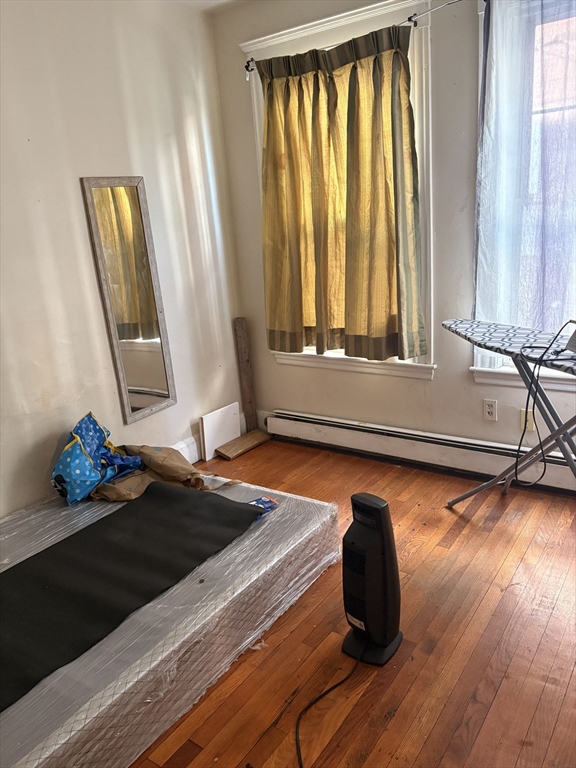 140 South Common Street Lynn, MA 01902 - Photo 3 of 10 a room with wooden floor and a window