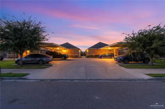 a street view with couple of cars parked on road