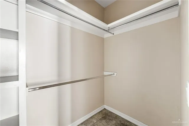 a view of an empty room and a window