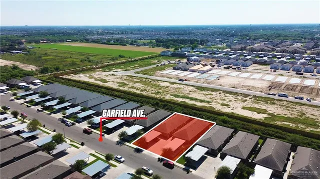 an aerial view of multiple houses with outdoor space
