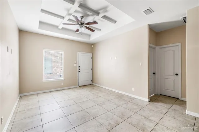 a large kitchen with cabinets and stainless steel appliances