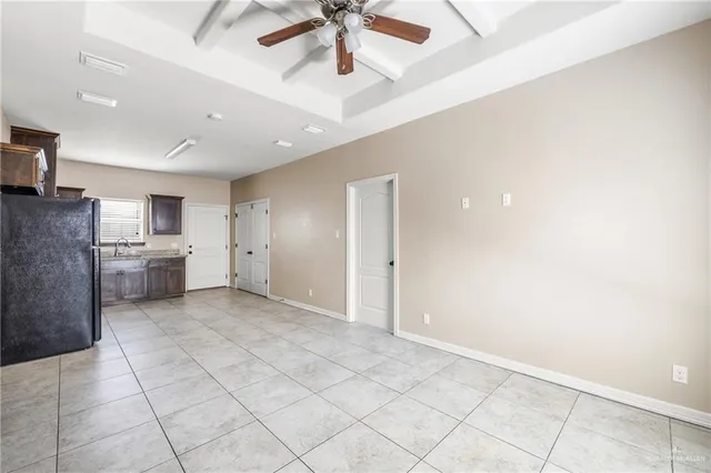 a kitchen with stainless steel appliances granite countertop a stove refrigerator and cabinets