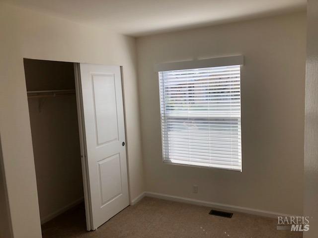 8154 D Street Windsor, CA 95492 - Photo 11 of 14 a view of an empty room with a window