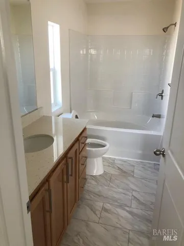 a view of an empty room with a bathroom