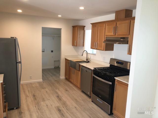 8154 D Street Windsor, CA 95492 - Photo 7 of 14 a kitchen with a sink stove and refrigerator