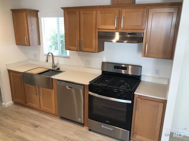 8154 D Street Windsor, CA 95492 - Photo 8 of 14 a kitchen with cabinets and steel stainless steel appliances