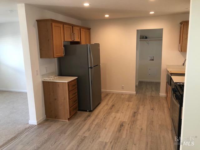 8154 D Street Windsor, CA 95492 - Photo 10 of 14 wooden floor in an empty room with a fireplace