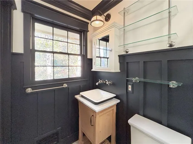 a bathroom with a sink and toilet