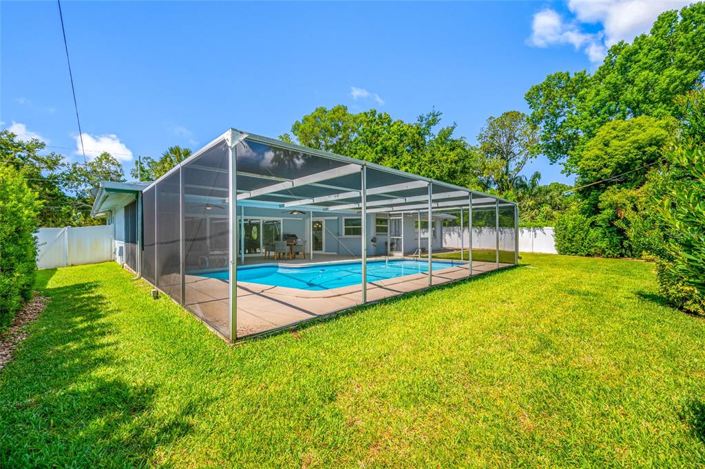 656 Mehlenbacher Road Belleair, FL 33756 - Photo 48 of 49 a view of a house with a backyard and swimming pool