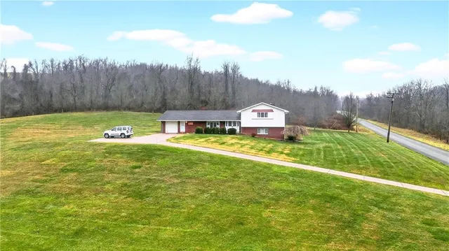 a view of a house with a big yard