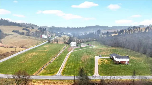 a view of a swimming pool with a yard