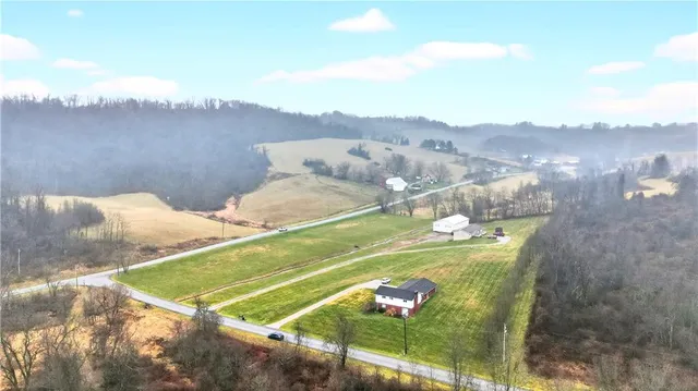 a kitchen with stainless steel appliances granite countertop a sink refrigerator and cabinets