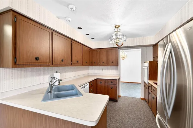a bathroom with a shower sink and mirror