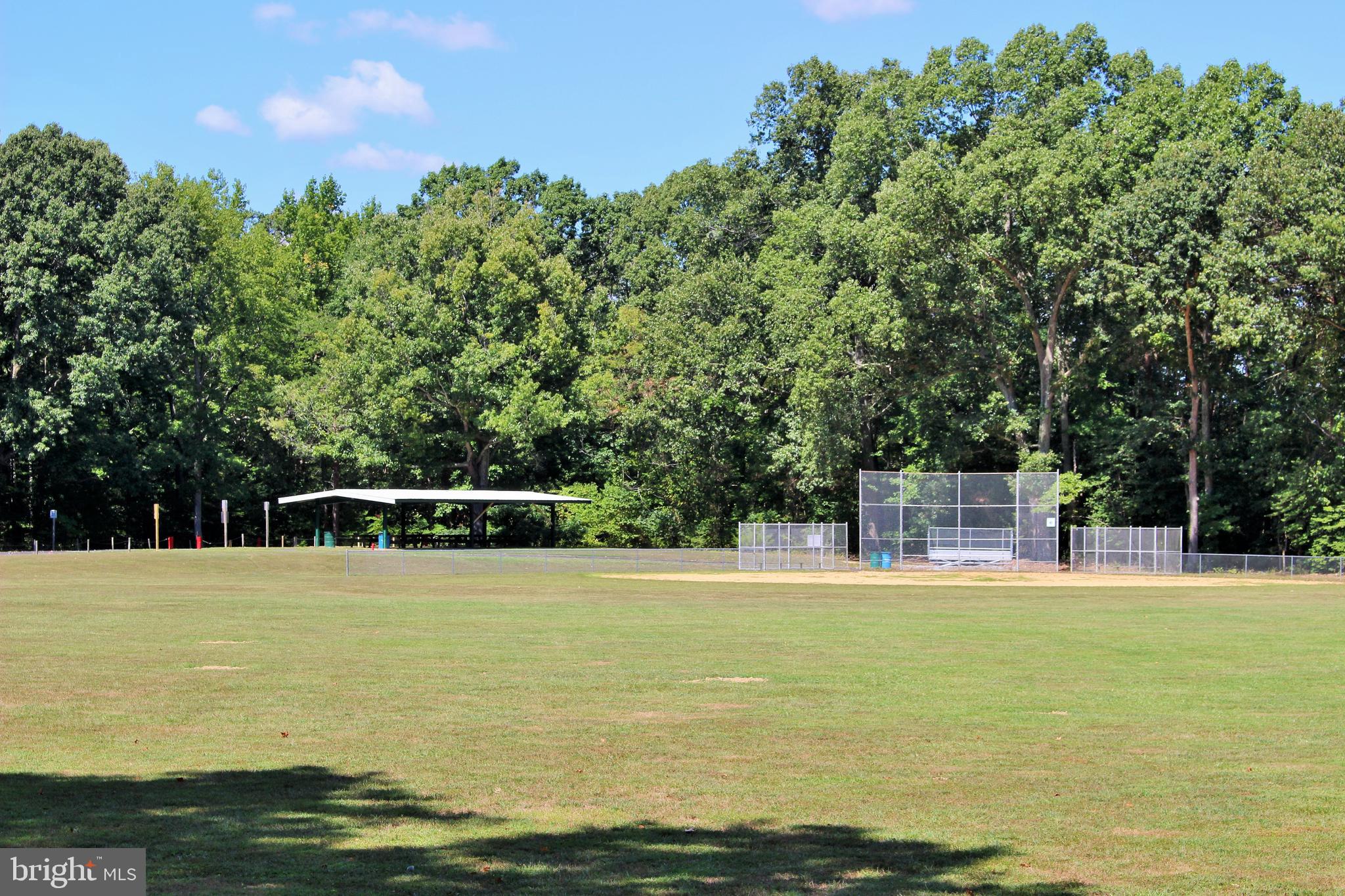 Long Leaf Lane Leonardtown, MD 20650 - Photo 5 of 6 a view of a swimming pool with an outdoor seating and a yard